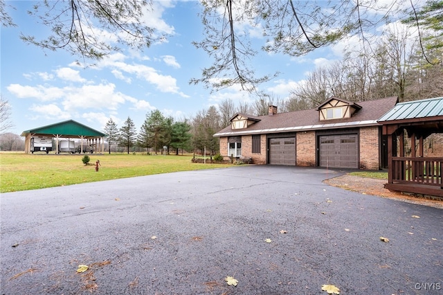 exterior space featuring a yard and a garage