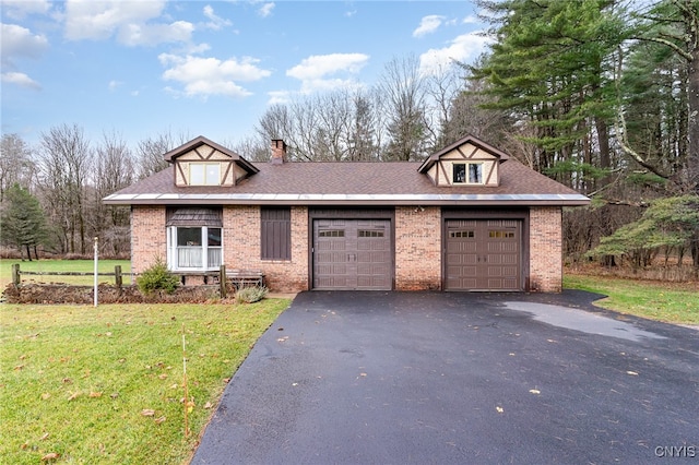 view of front of property with a front lawn and a garage