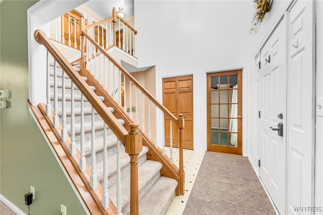 stairs featuring carpet floors