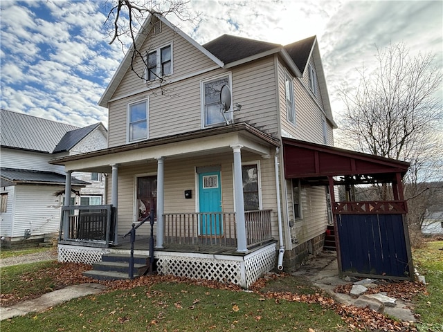 view of front of home with a front lawn and a porch