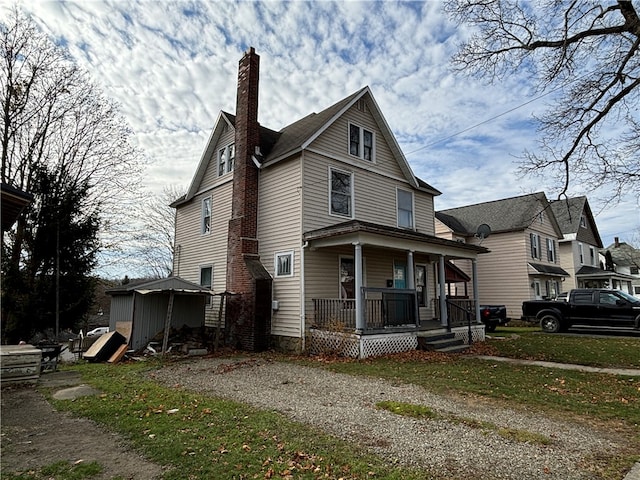 view of front of property featuring covered porch