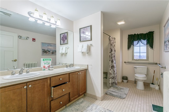 bathroom with toilet, a shower with curtain, vanity, and tile patterned floors