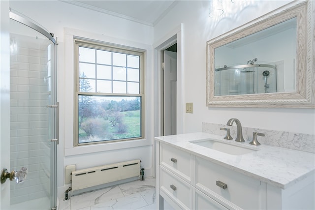 bathroom featuring vanity, crown molding, a wealth of natural light, and a baseboard heating unit