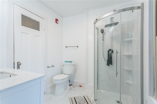 bathroom featuring vanity, toilet, and a shower with shower door