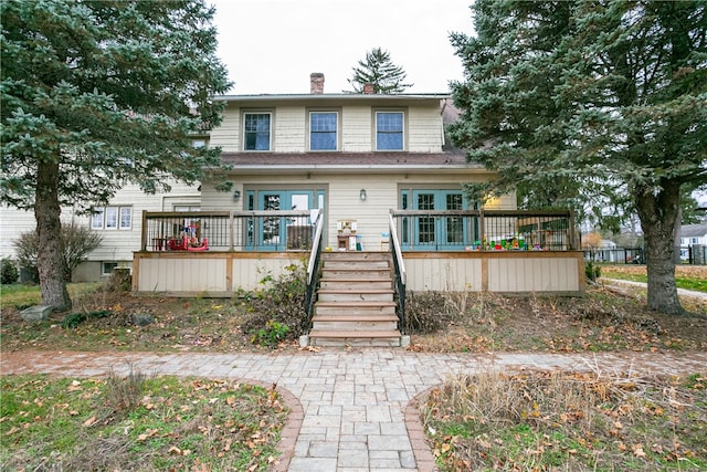 view of front of home with a wooden deck