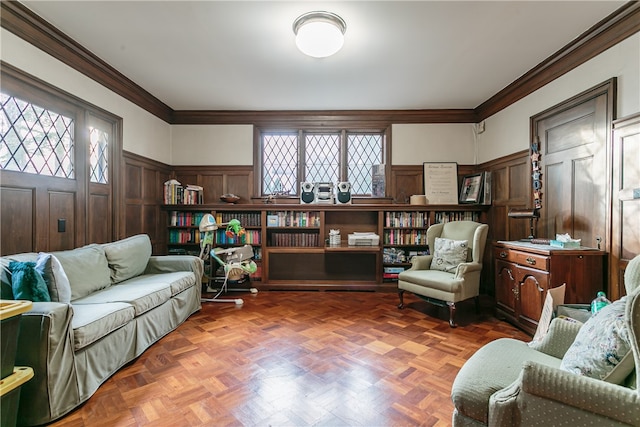 living room featuring dark parquet flooring and crown molding