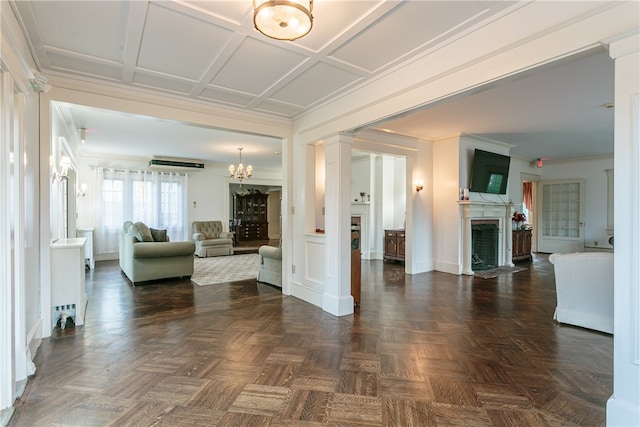 living room with dark parquet flooring and decorative columns