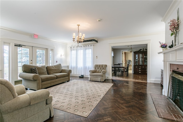 living room with a fireplace, french doors, an inviting chandelier, and a wealth of natural light