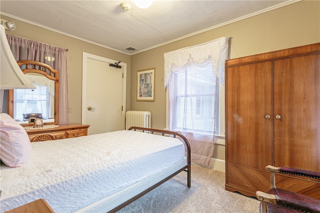 carpeted bedroom featuring a closet, radiator heating unit, and ornamental molding