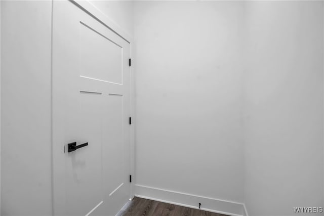 washroom with dark hardwood / wood-style flooring