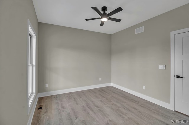 spare room featuring ceiling fan and light hardwood / wood-style flooring