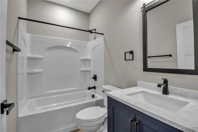 full bathroom with shower / tub combination, vanity, and toilet