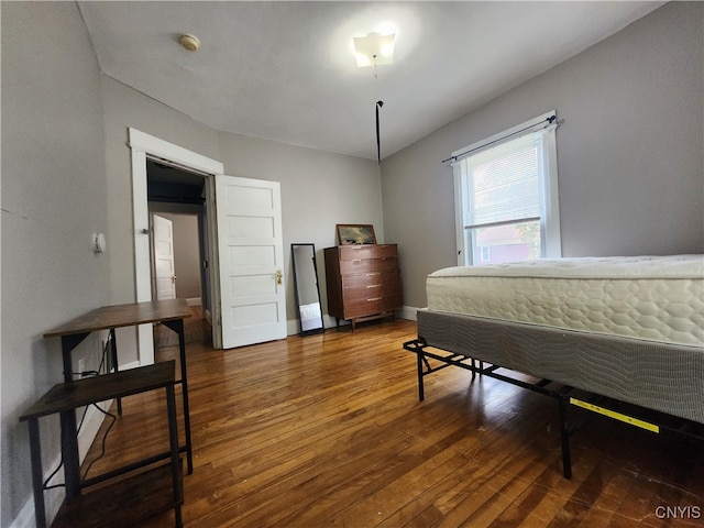 bedroom featuring dark hardwood / wood-style flooring