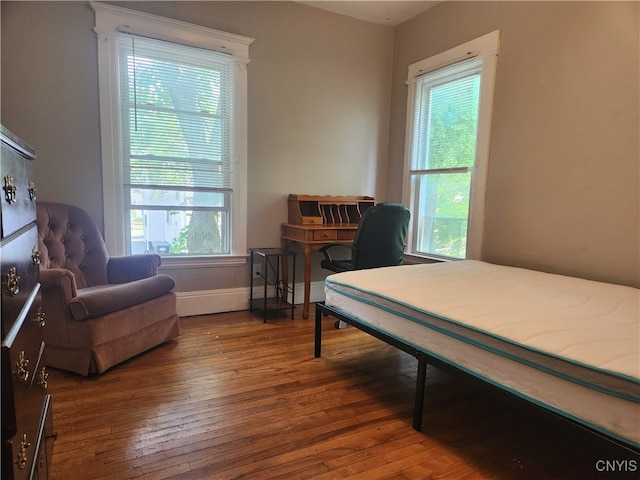 bedroom featuring dark hardwood / wood-style floors