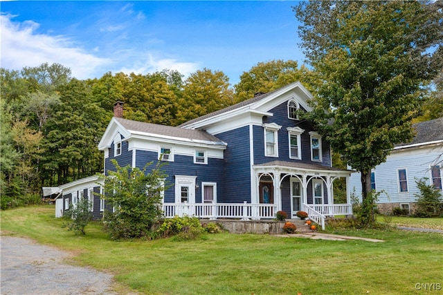 view of front of home featuring a porch and a front yard