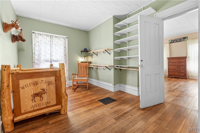 sitting room featuring hardwood / wood-style flooring and a wealth of natural light