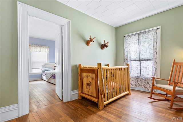 bedroom with hardwood / wood-style flooring