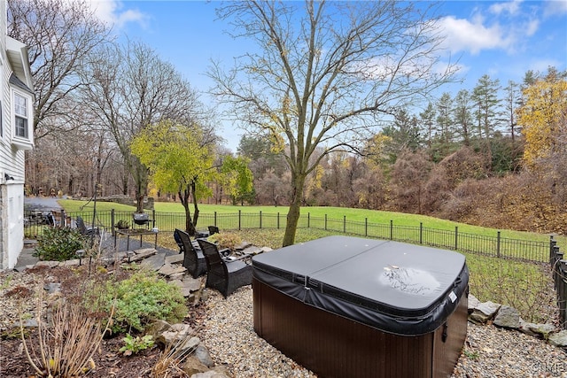 view of yard featuring a rural view and a hot tub