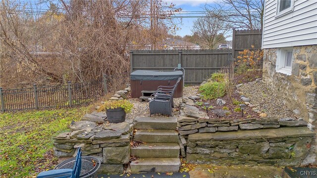 view of yard with a hot tub