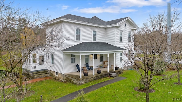 view of front property with a front lawn and a porch