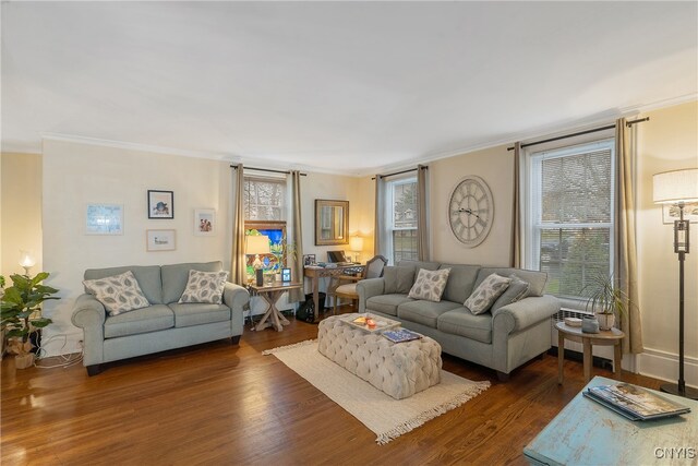 living room with crown molding and dark hardwood / wood-style floors