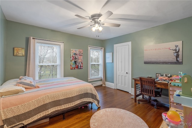 bedroom featuring dark hardwood / wood-style floors and ceiling fan