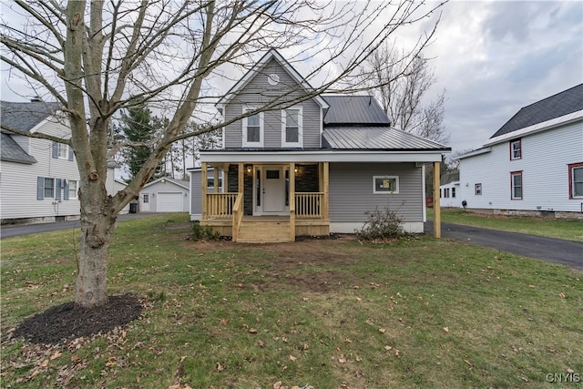 view of front of property featuring a front lawn and a porch