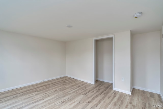 spare room featuring light hardwood / wood-style floors