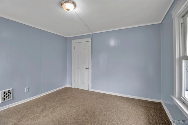 carpeted empty room with ornamental molding