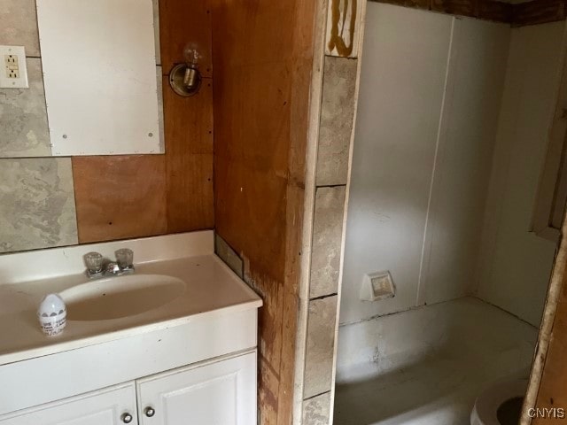 bathroom with vanity and a bathing tub