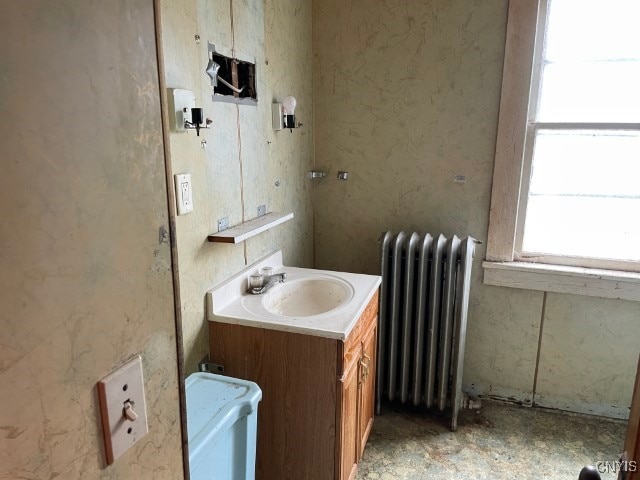 bathroom with vanity and radiator