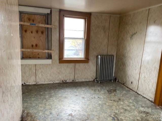 spare room featuring radiator heating unit