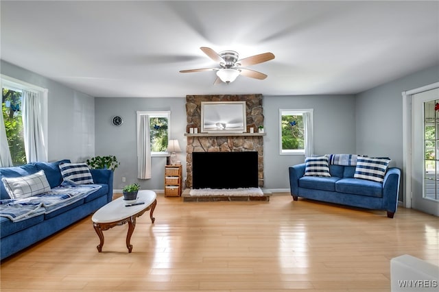 living room with a healthy amount of sunlight and light wood-type flooring