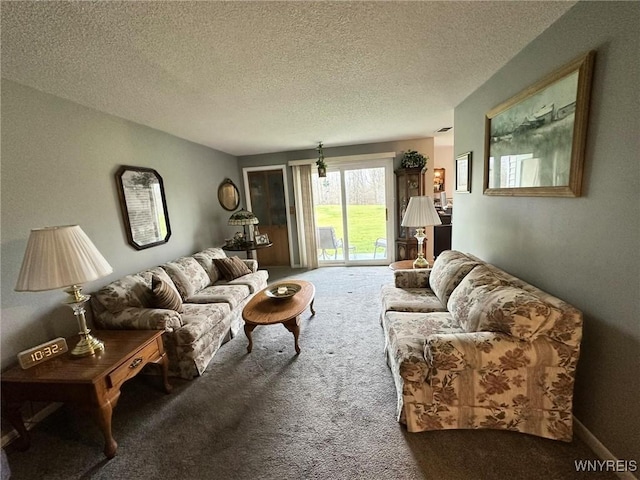 carpeted living room featuring a textured ceiling