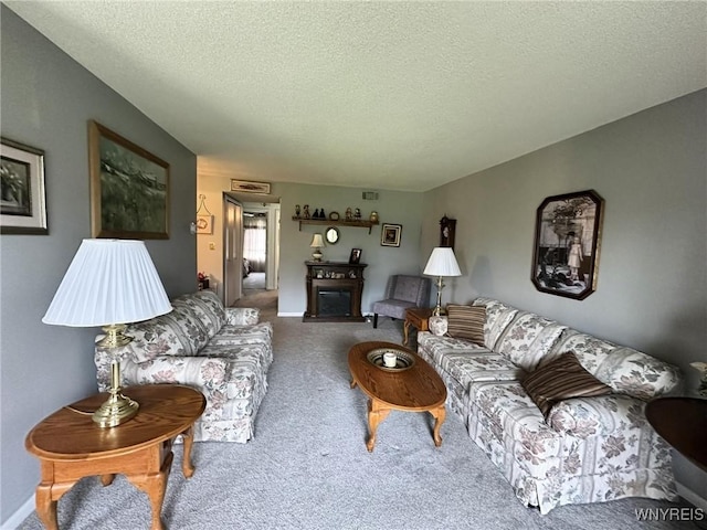 carpeted living room with a textured ceiling