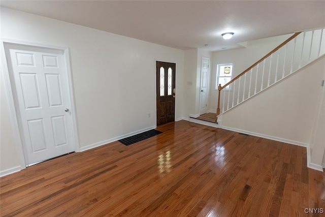 entryway with hardwood / wood-style floors