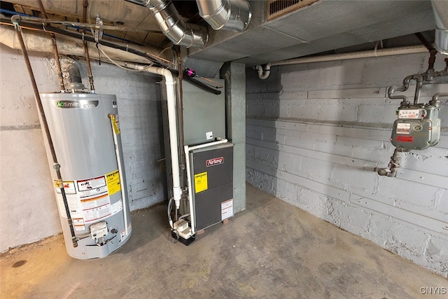 utility room with heating unit and water heater