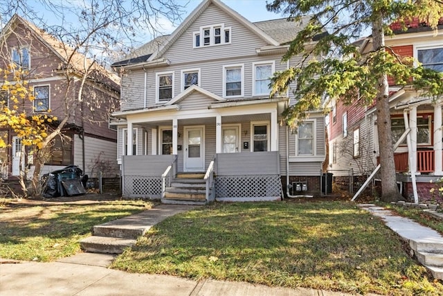 view of front of house featuring cooling unit, a front lawn, and a porch