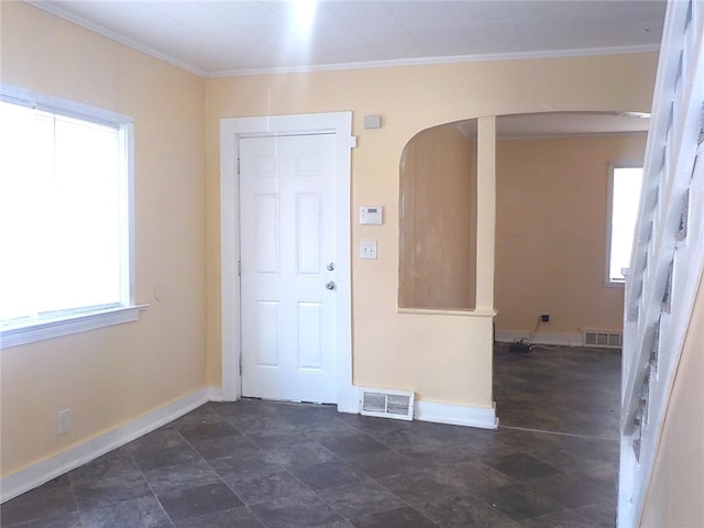 entryway featuring ornamental molding