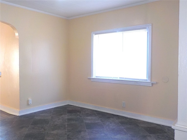 unfurnished room featuring ornamental molding