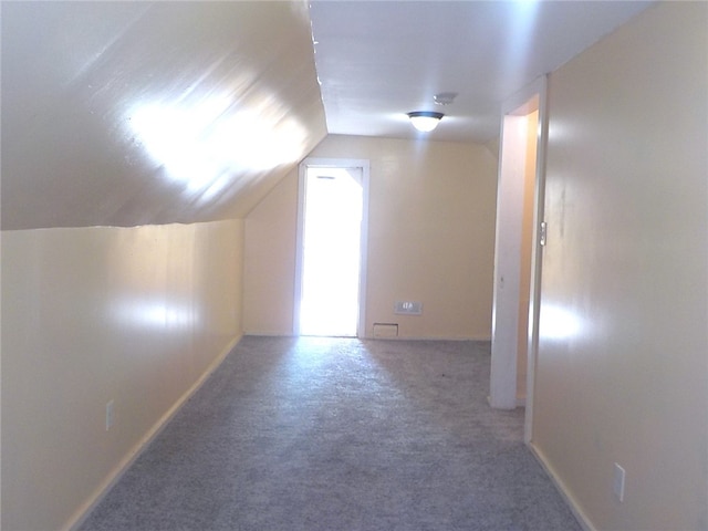 bonus room featuring carpet and lofted ceiling