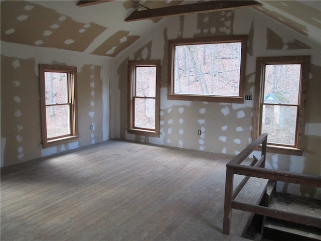 living room featuring hardwood / wood-style flooring and lofted ceiling with beams