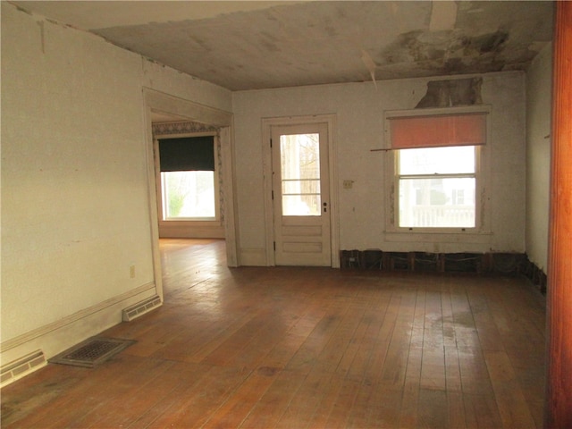 empty room featuring hardwood / wood-style flooring