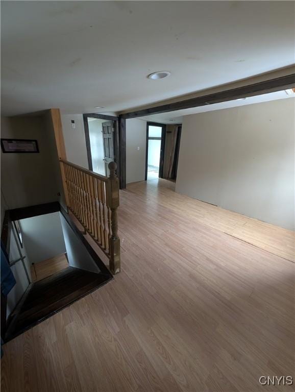 empty room with hardwood / wood-style flooring