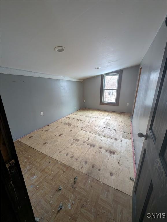 unfurnished room featuring light parquet floors