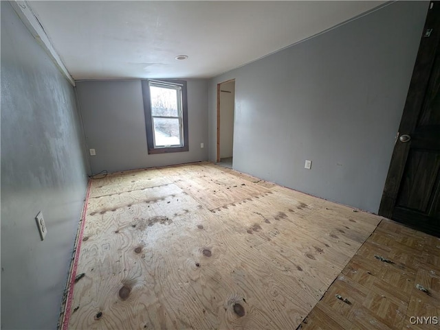 empty room with light parquet floors