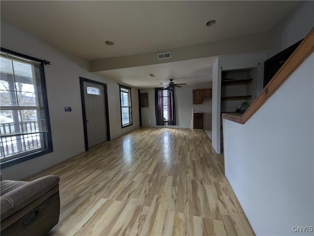 entrance foyer with light wood-type flooring and ceiling fan