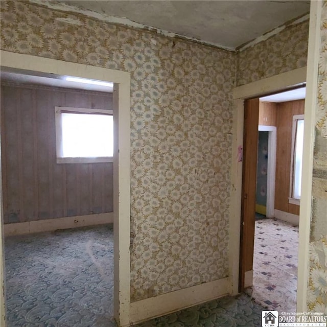 130/118 N Main St, New Albion, NY 14719 - spare room featuring wood walls