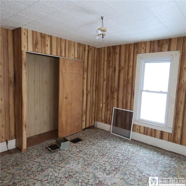 130/118 N Main St, New Albion, NY 14719 - spare room featuring wood walls