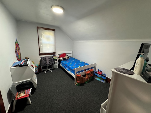 bedroom featuring carpet and lofted ceiling